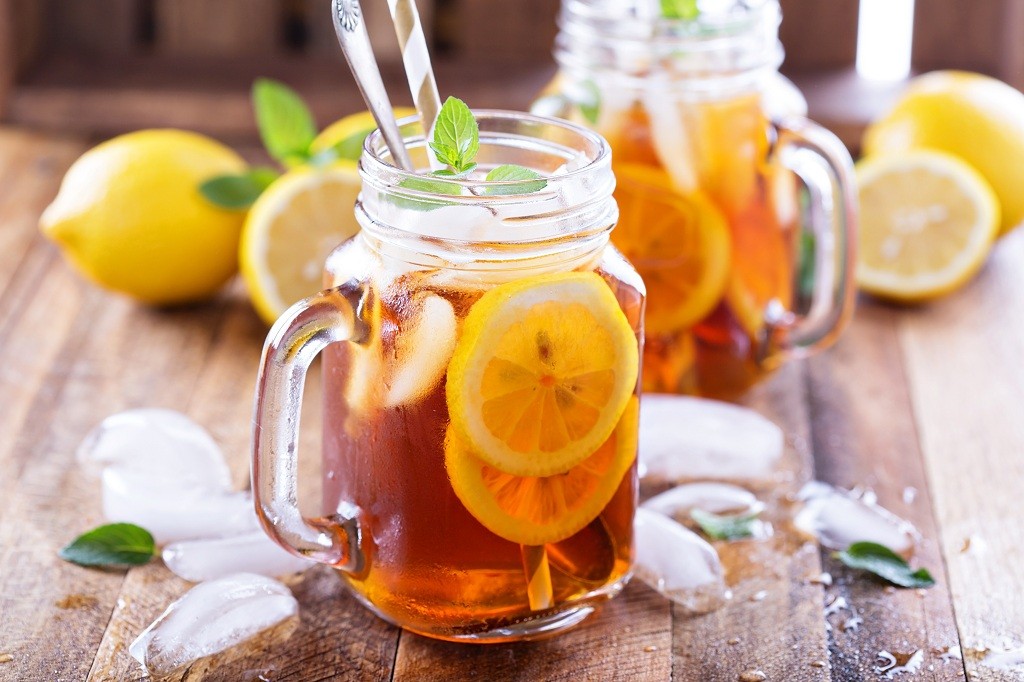 cups of lemon juice, ice and lemon on the table cups of lemon juice, ice and lemon on the table