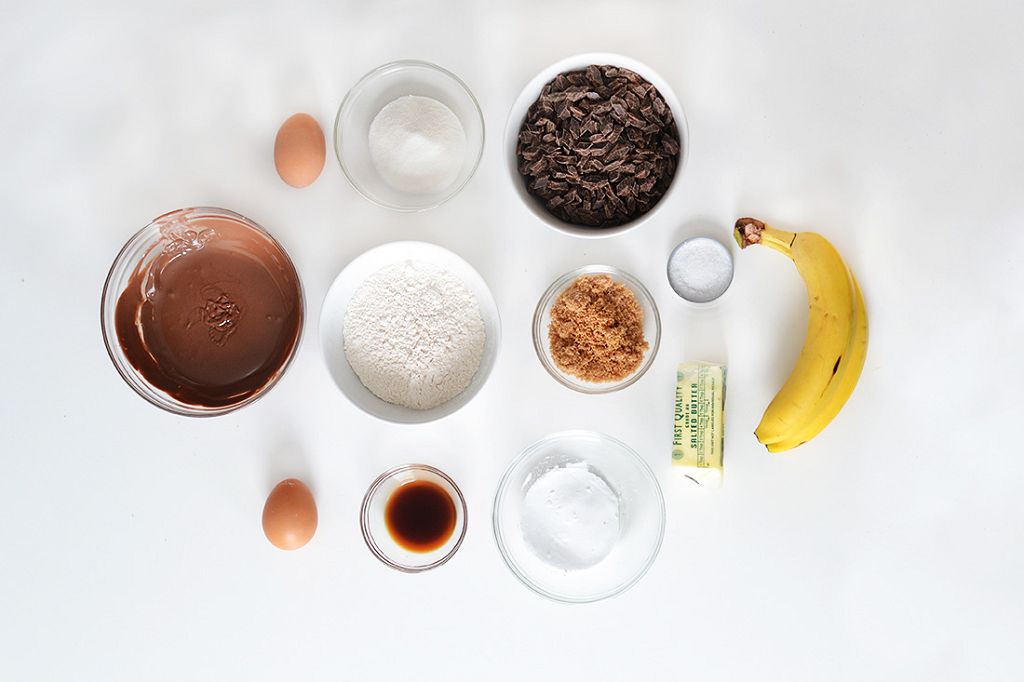 a cup of melted Nutella, a cup of sugar, sticks of butter, 2 eggs ,a banana, a teaspoon of salt, a teaspoon of baking soda and a teaspoon of baking powder Cooking spray a cup of melted Nutella, a cup of sugar, sticks of butter, 2 eggs ,a banana, a teaspoon of salt, a teaspoon of baking soda and a teaspoon of baking powder Cooking spray