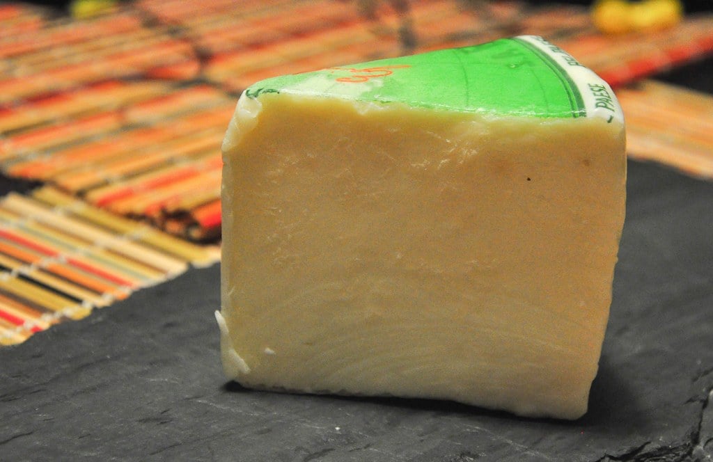A Piece of Bel Paese Cheese on the table