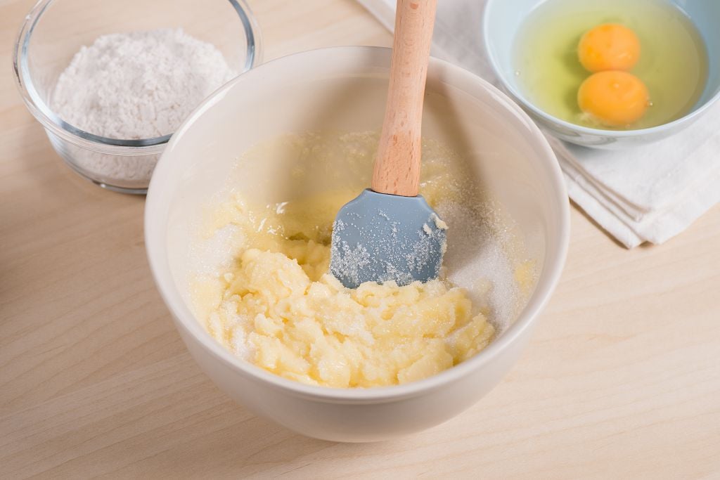 a bowl of butter and a bowl of eggs