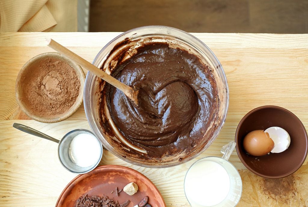 a bowl of melt nutella and a bowl of eggs