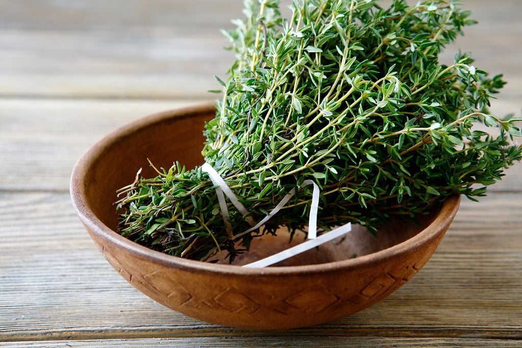 a bunch of summer savory in the bowl