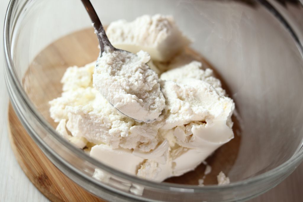 A bowl of Ricotta Cheese and a spoon