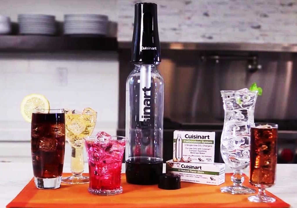  soda makers and cups of soda on the table