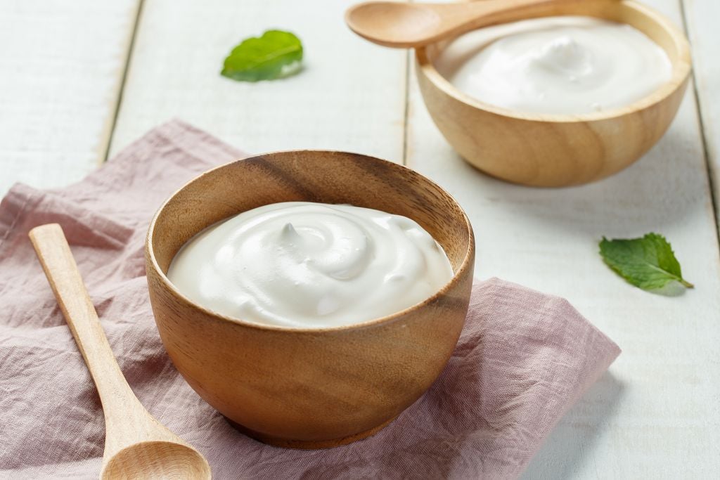 bowls of Greek Yogurt and spoons