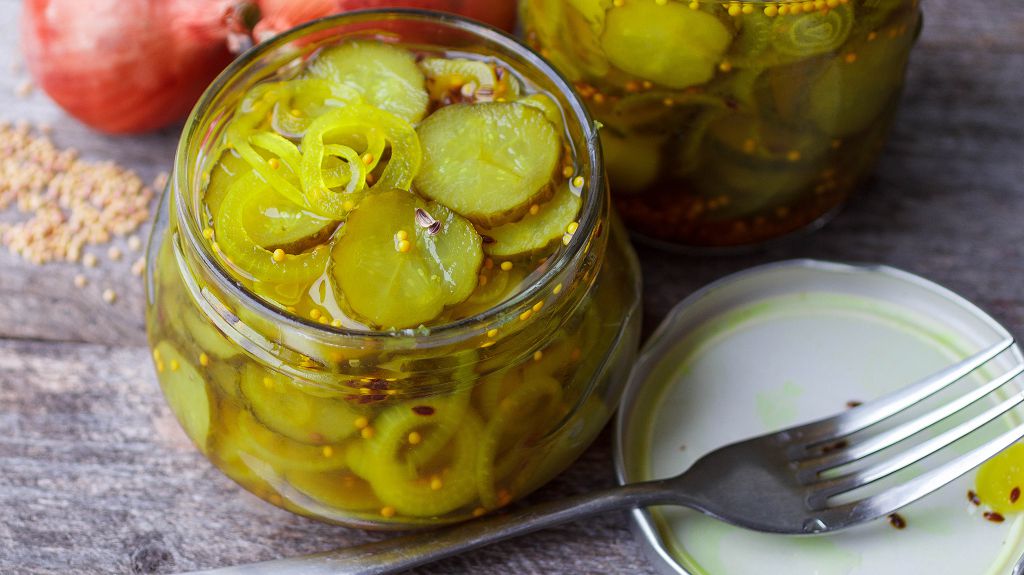 jars of pickles and a fork