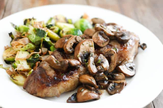 a plate of Fried mushrooms and vegetables