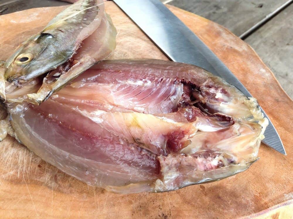 Pompano Fillets and a knife on the chopping board