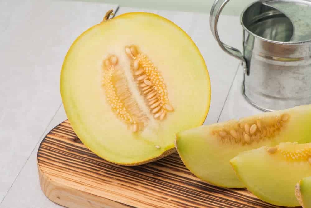 slices of honeydew melons on the chopping board