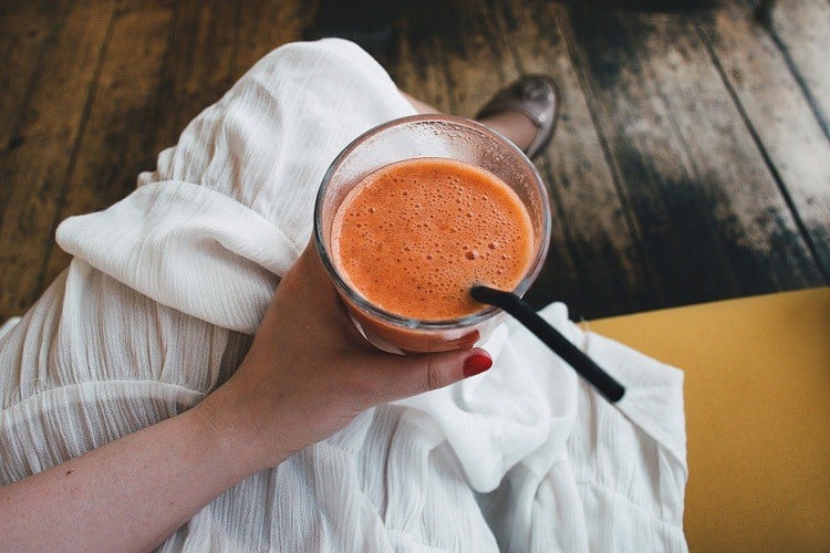 A cup of Smoothies and straws