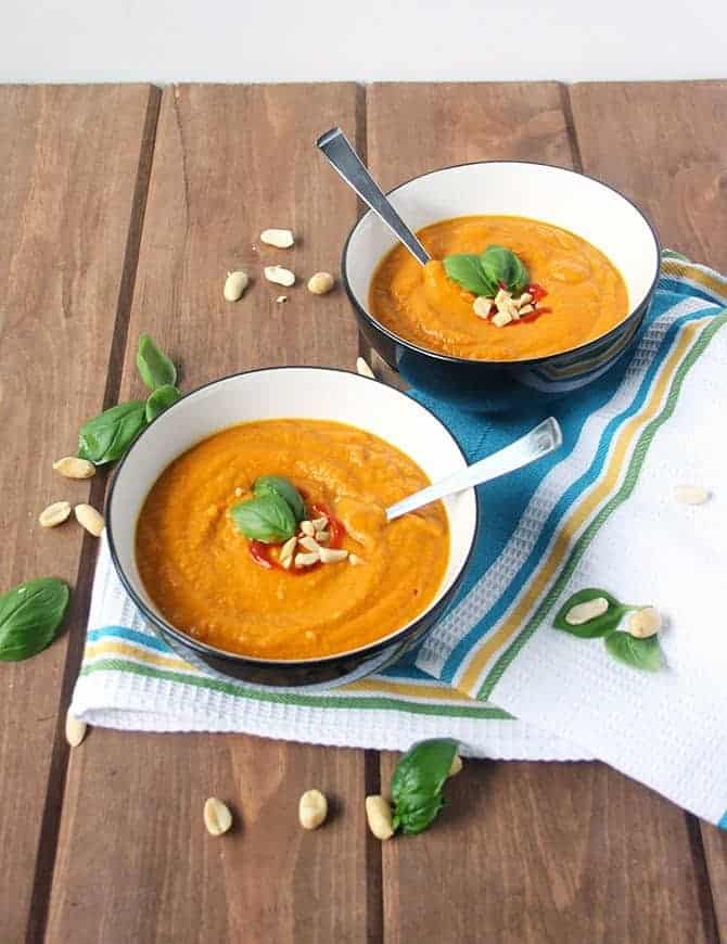 bowls of porridge with peanuts and spoons