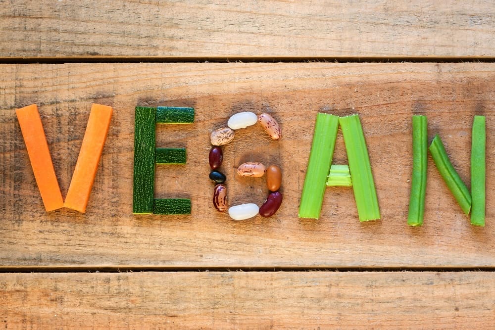 Vegan by vegetables on the table