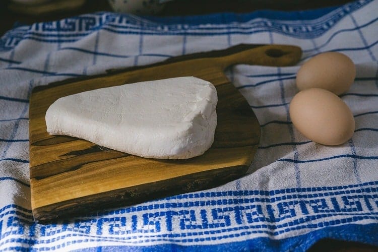 Cottage Cheese on the chopping board and eggs