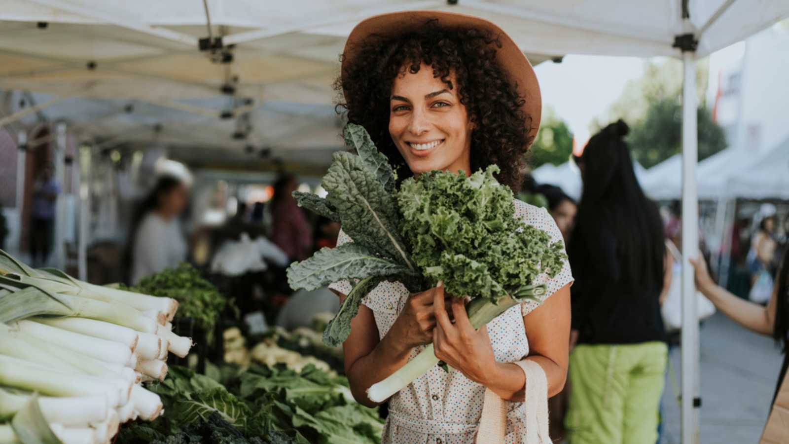 Woman buying kale