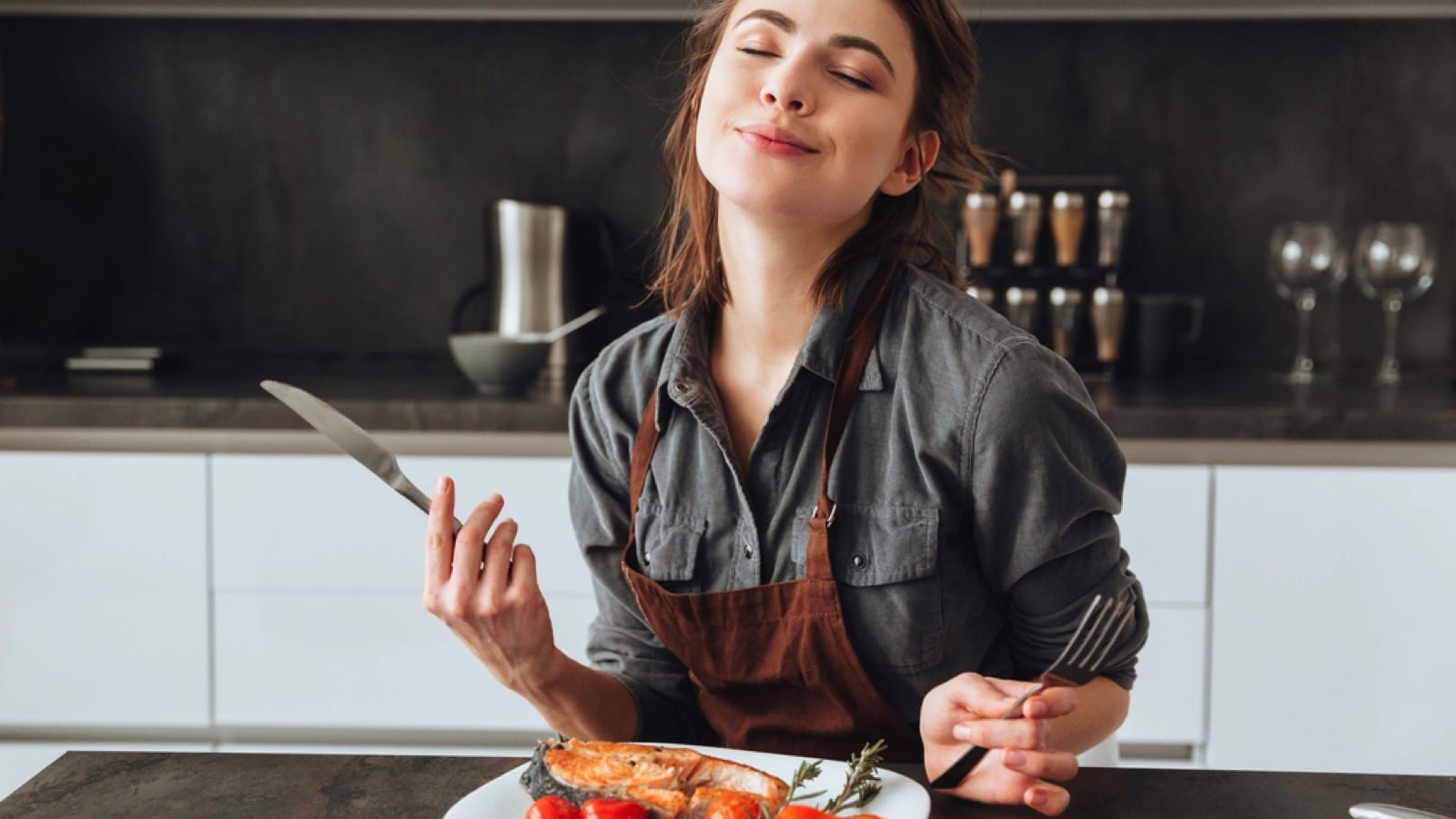 Woman tasting her dish