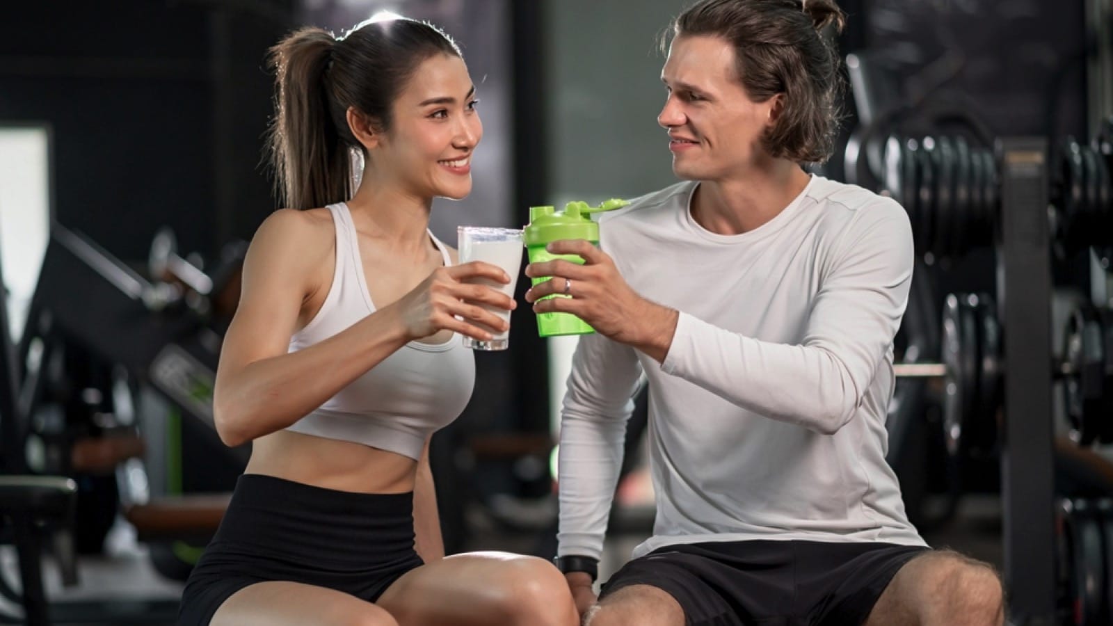 Young beautiful woman and handsome boy workout