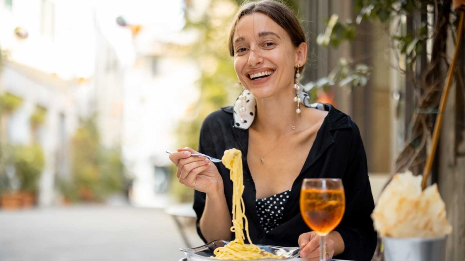 Woman eating Carbonara