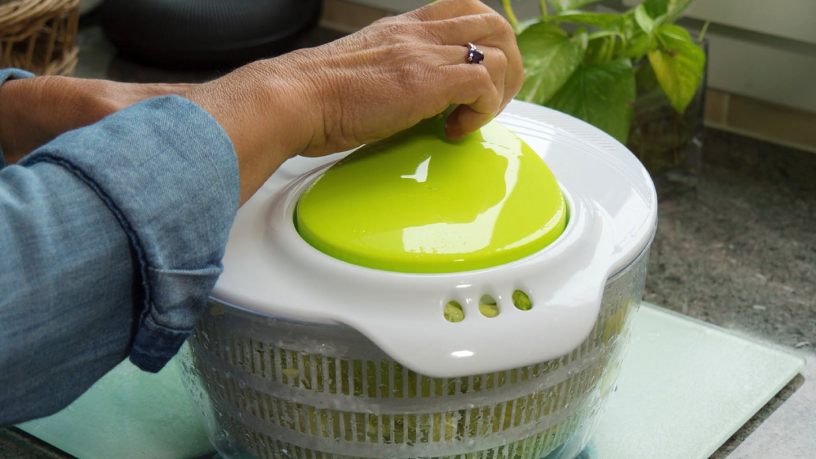 Woman using Salad Spinner